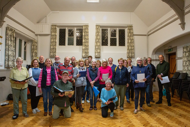 The choir assembled in Whiteshill Village Hall